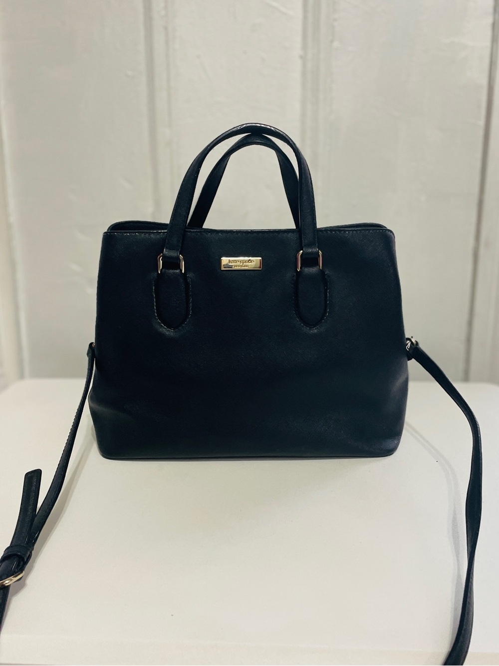 Kate Spade Top Handle Handbag with adjustable detachable crossbody strap.